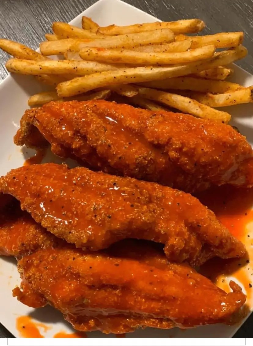 Lemon pepper hot dipped catfish with a side of fries