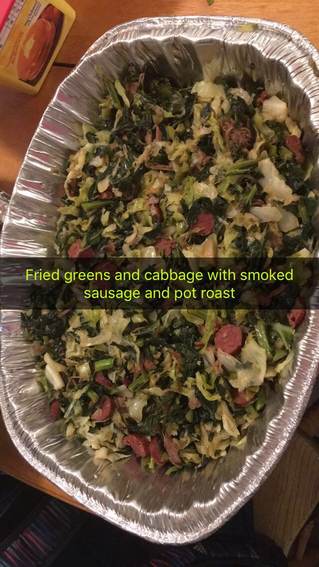 Full pan of fried greens and cabbage with smoked sausage and pot roast